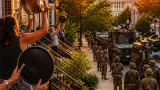 DC residents mark a year of nightly protest as thousands of troops continue patrolling streets